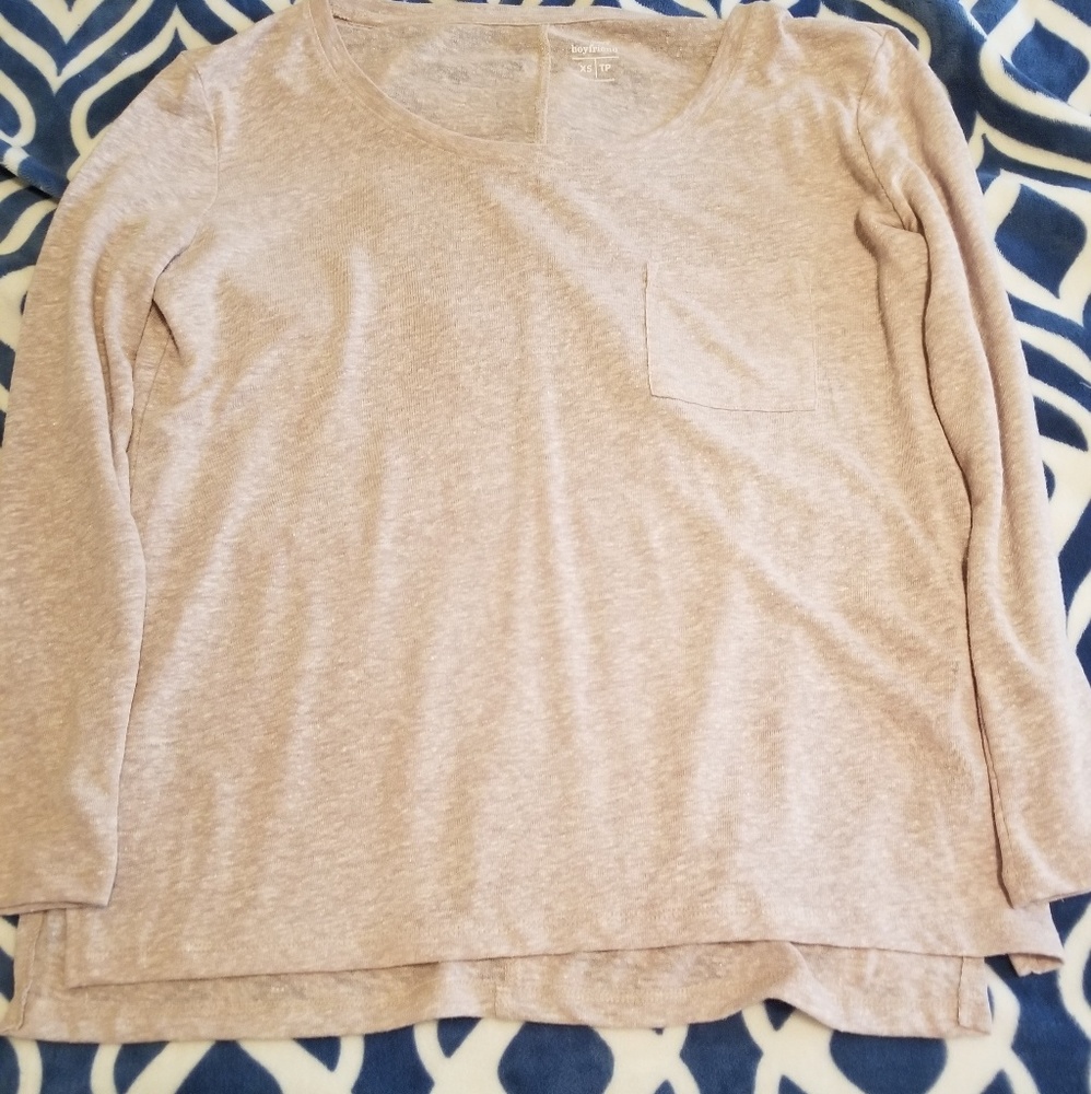 Long sleeved blush color scoop neck shirt.
